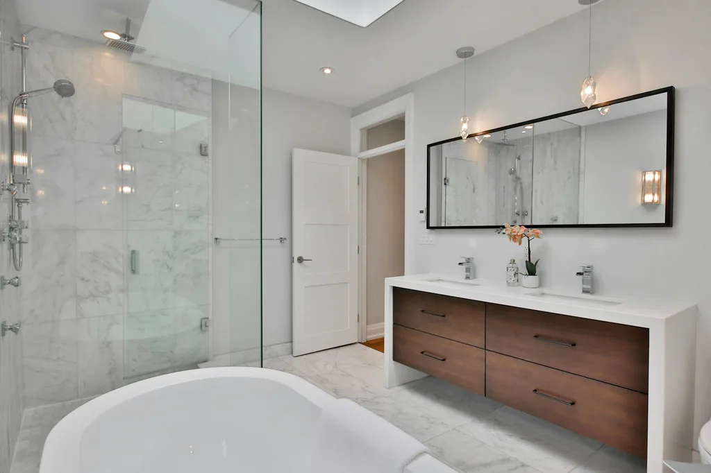 Luxury bathroom renovation with refined fixtures and finishes